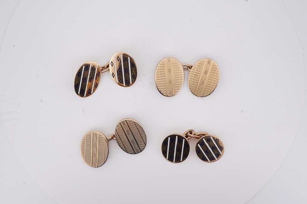 A pair of early to mid 20th century Austro Hungarian yellow metal and two colour enamel set oval cufflinks and a pair of 1930's engine turned 9ct gold oval cufflinks, gross weight 22 grams. Condition - fair
